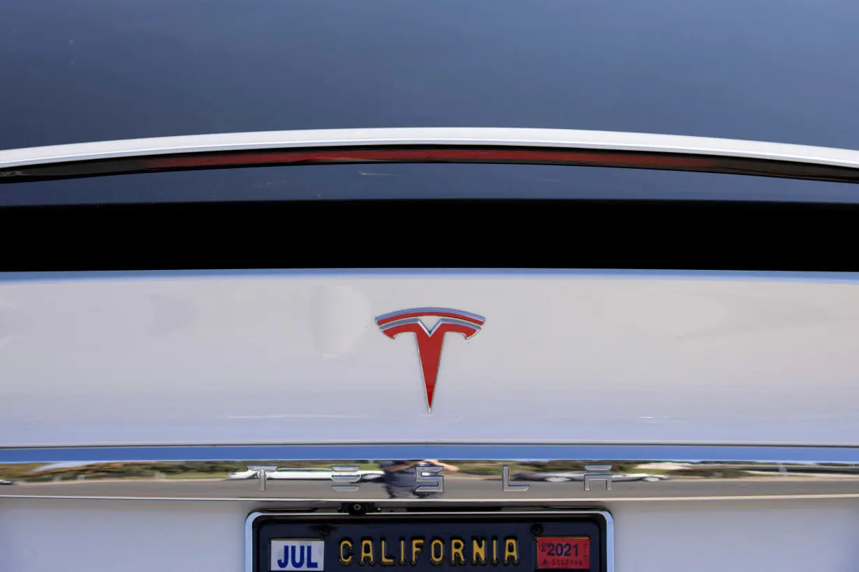 FILE PHOTO: A Tesla Model X is shown at a Tesla service center in Costa Mesa, California