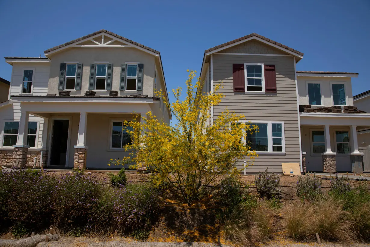 FILE PHOTO: Single-family homes by KB Home are shown under construction in the community of Valley Center, California