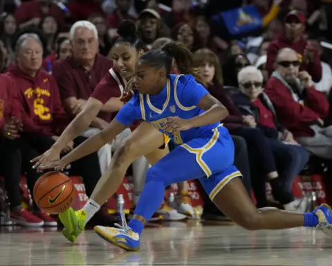 No. 9 USC hands second-ranked UCLA its first loss of the season 73-65 and Watkins scores 32 points