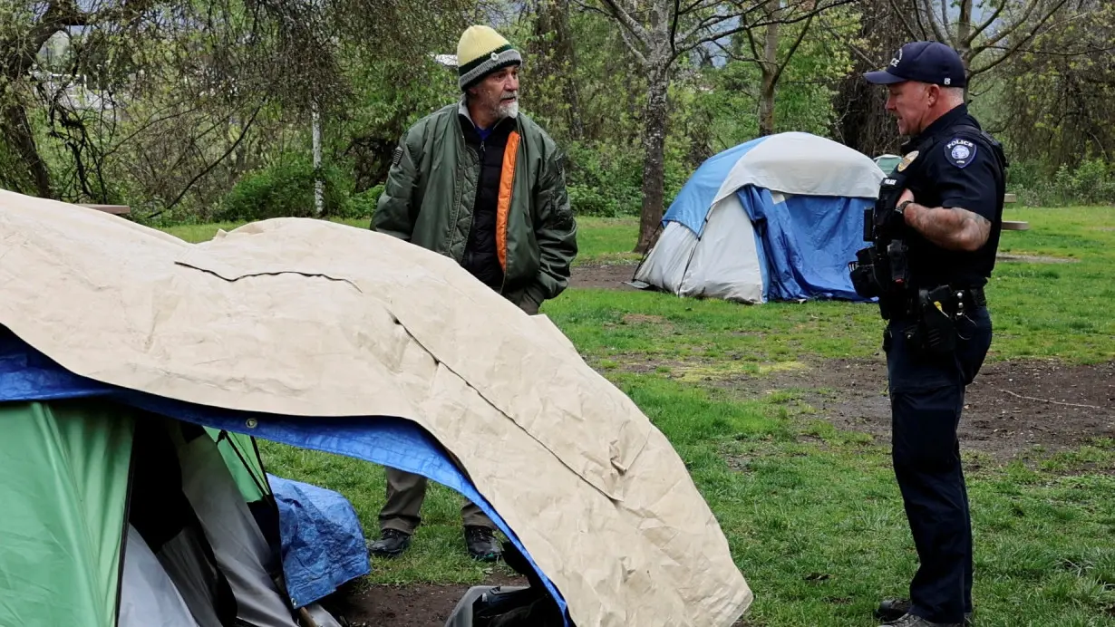 FILE PHOTO: Homeless people are evacuated from a park in Grants Pass