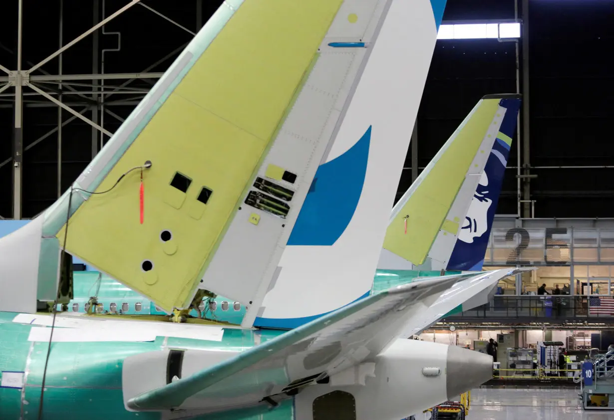 FILE PHOTO: The tail of Boeing's new 737 MAX-9 is pictured next to an older model under construction at their production facility in Renton, Washington