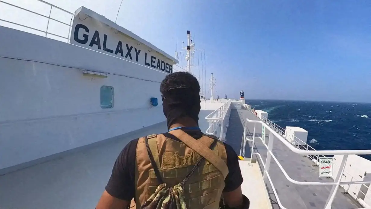 FILE PHOTO: Houthi fighter stands on the Galaxy Leader cargo ship in the Red Sea