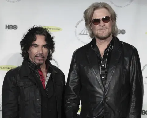 Daryl Hall is suing John Oates over plan to sell stake in joint venture. A judge has paused the sale