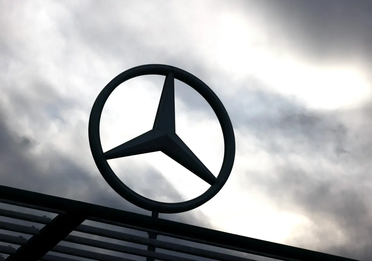 A logo of Mercedes-Benz is seen outside a Mercedes-Benz car dealer in Brussels