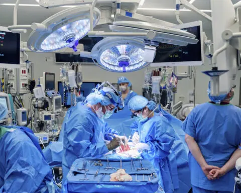 Doctors combine a pig kidney transplant and a heart device in a bid to extend woman's life