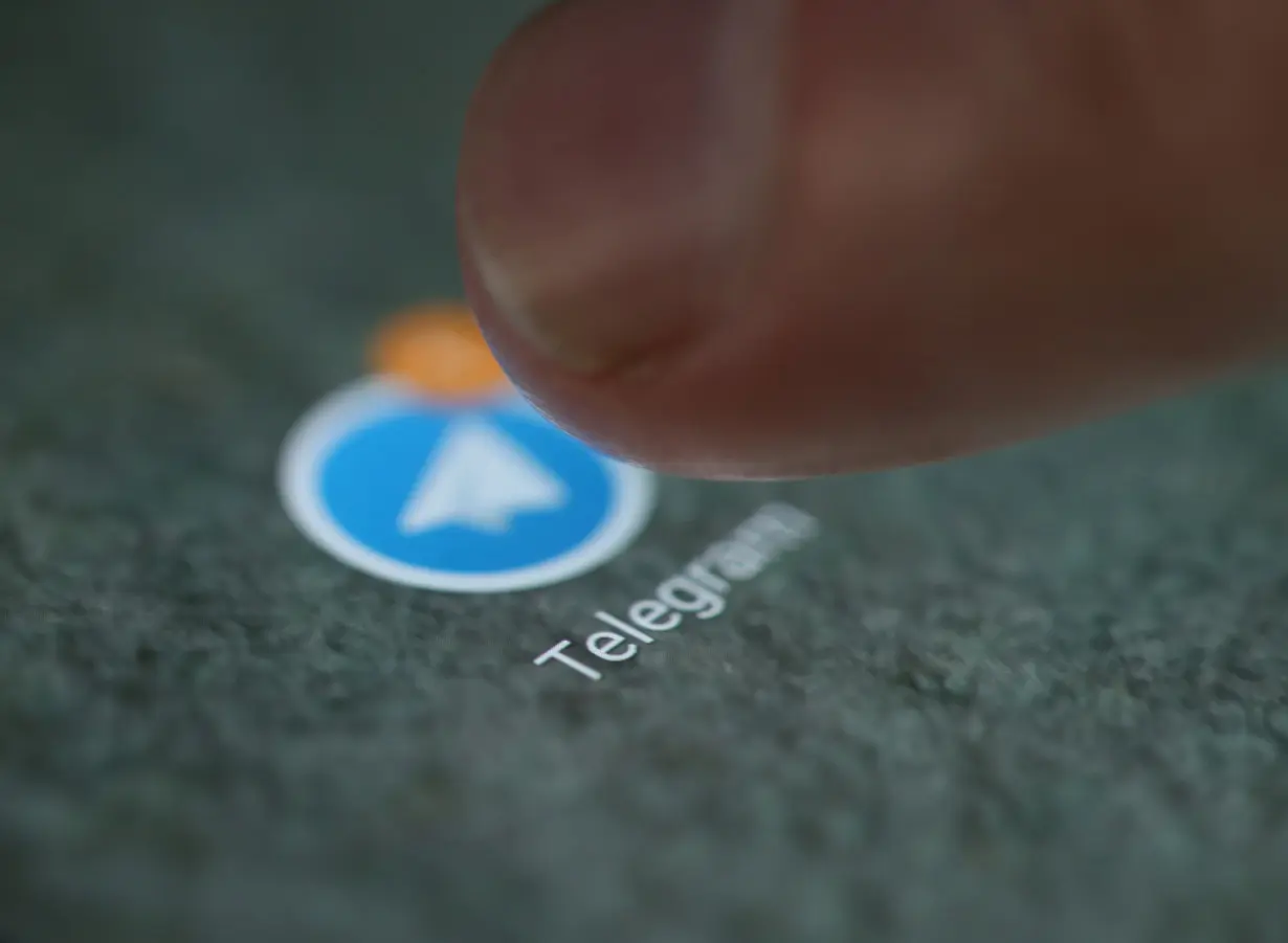 The Telegram app logo is seen on a smartphone in this illustration