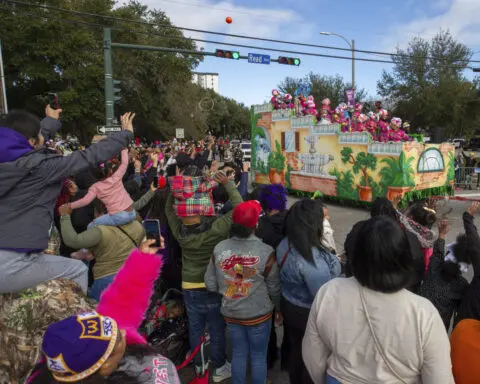 As Mardi Gras nears, a beefed-up police presence and a rain-scrambled parade schedule in New Orleans