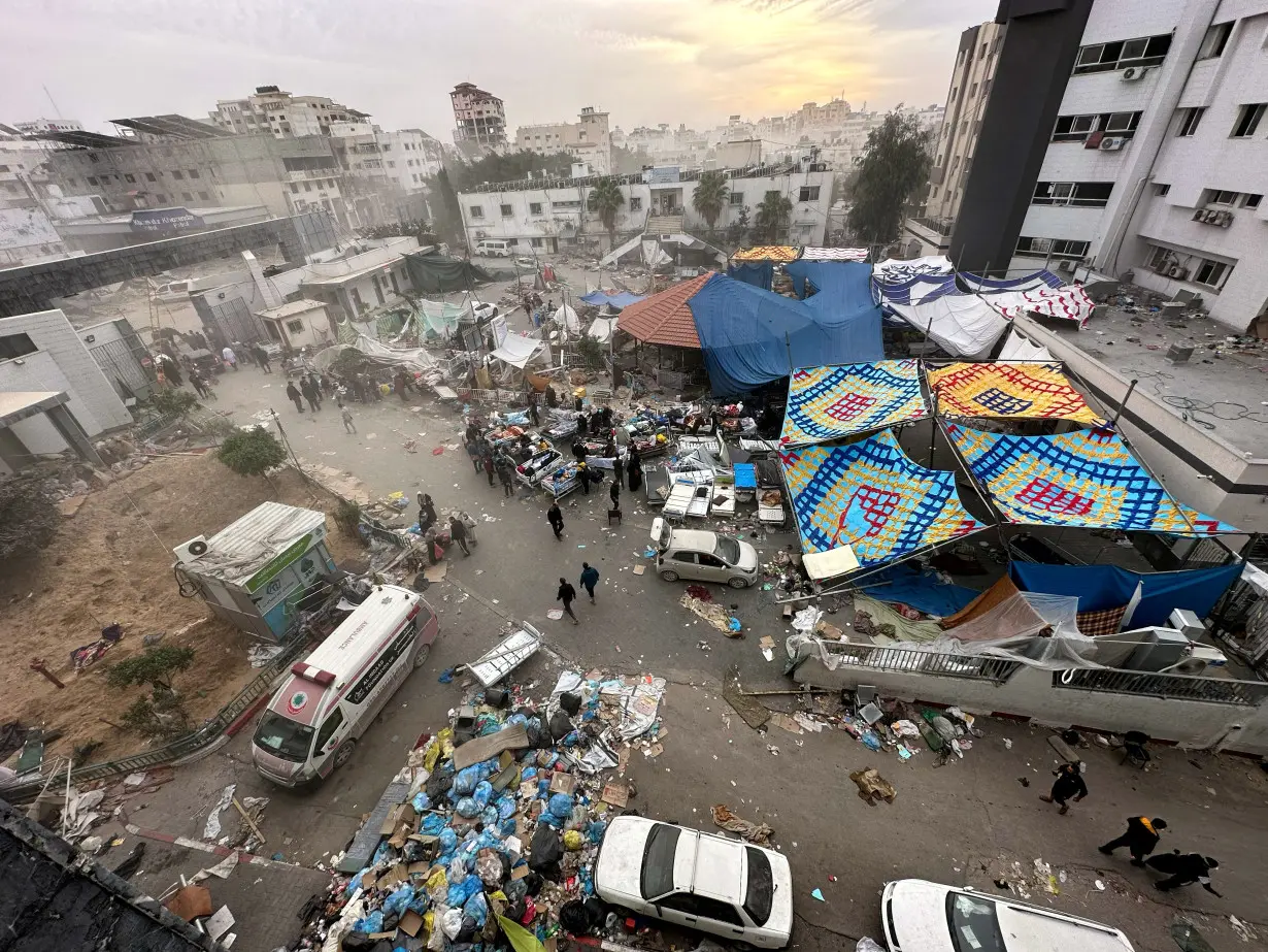 FILE PHOTO: Palestinians inspect Al Shifa Hospital, in Gaza City