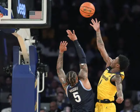 No. 10 Marquette rebounds in OT after potential winner waved off, beats Villanova 71-65 in Big East