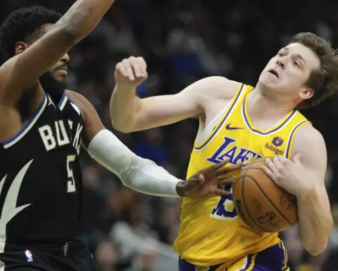 Reaves' triple-double, tiebreaking 3 helps rally Lakers past Bucks in 2OTs without LeBron James