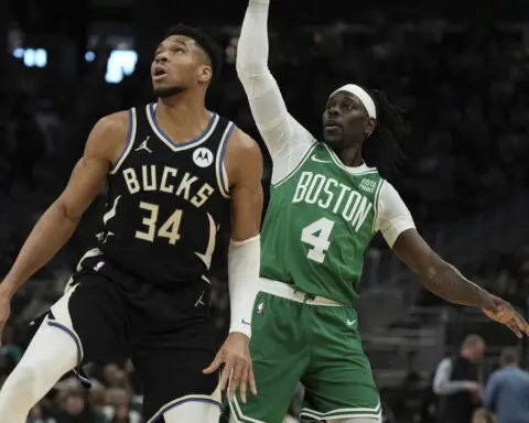 Antetokounmpo leaves Bucks' game with Celtics after grabbing his left calf while running up court