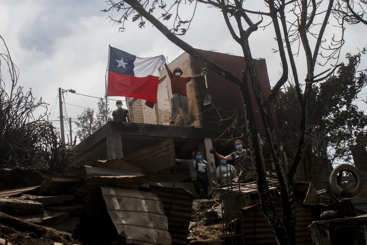 Survivors of Chile wildfires search through debris as death toll reaches 122