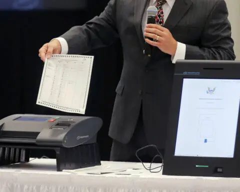 Voting technology company settles lawsuit against far-right news outlet over 2020 election claims