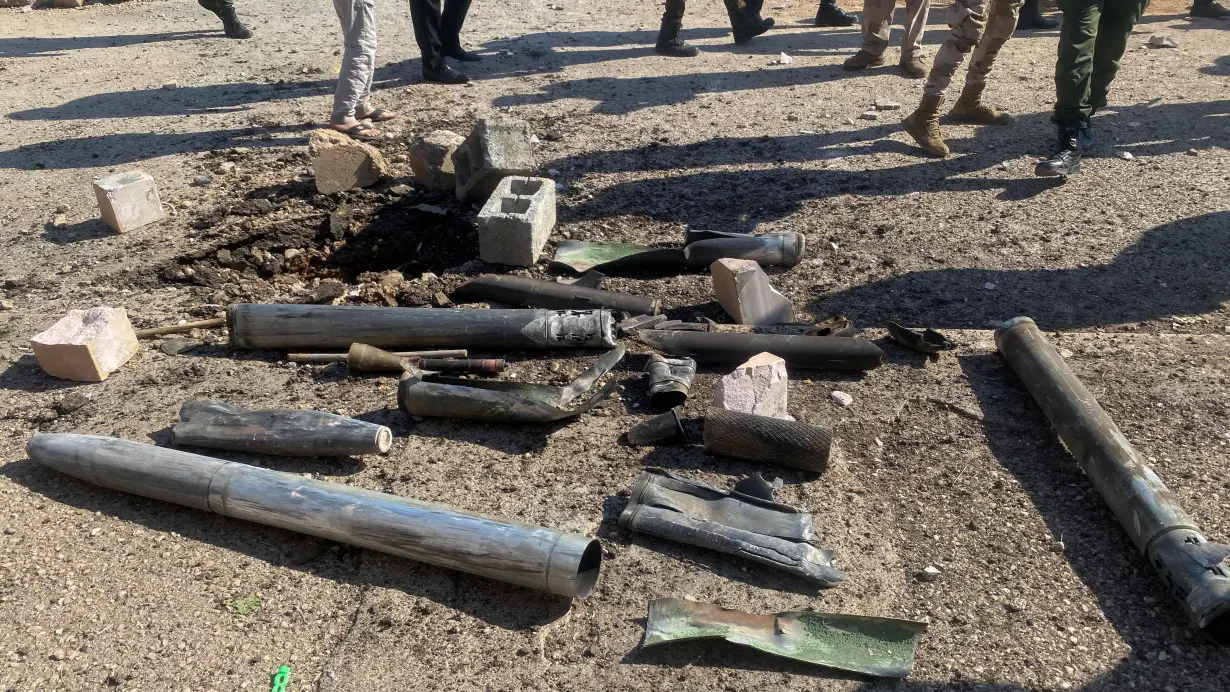 Shell casings lie at the site of a U.S. airstrike in al-Qaim