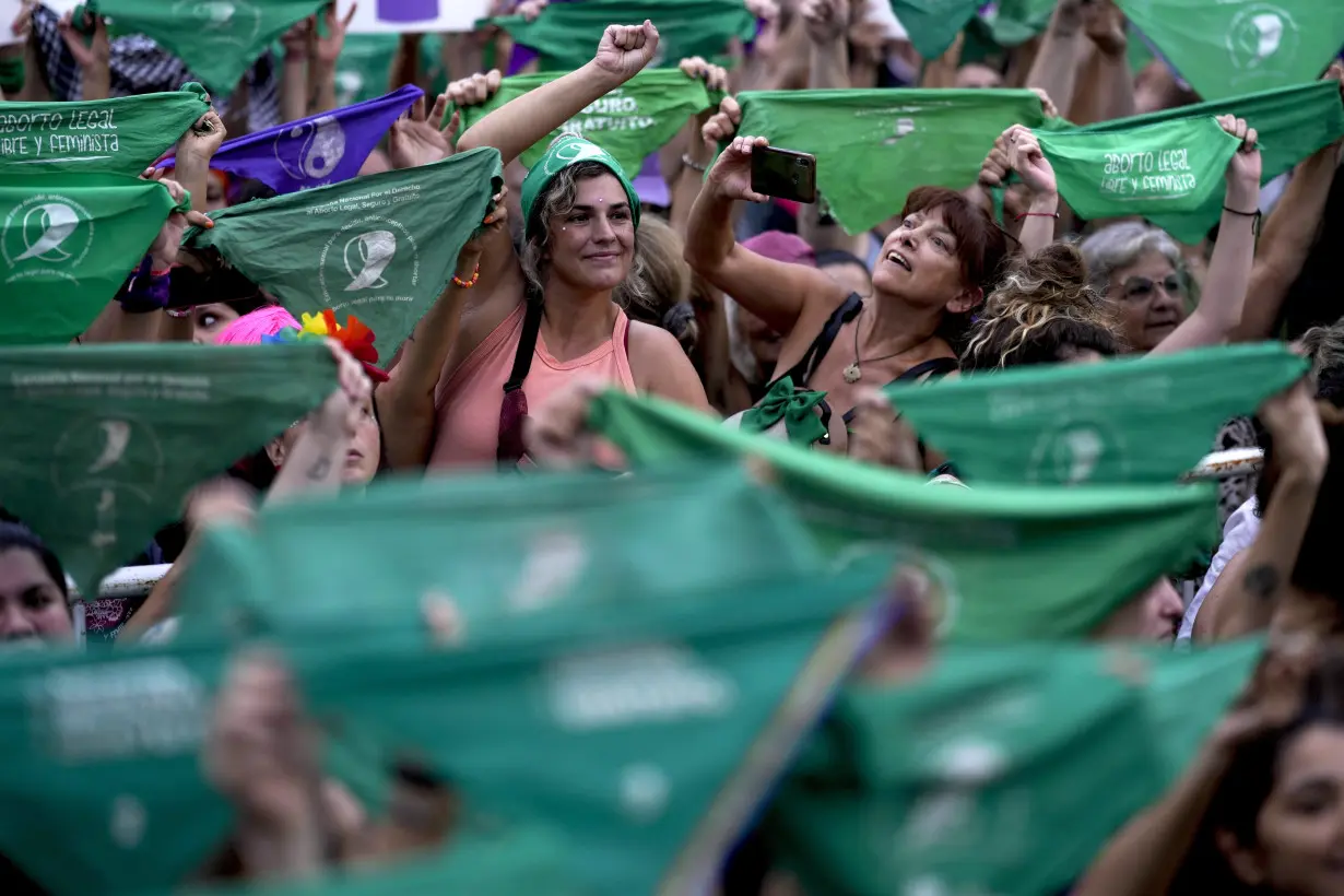 Facing historic shifts, Latin American women bathe streets in purple on International Women's Day