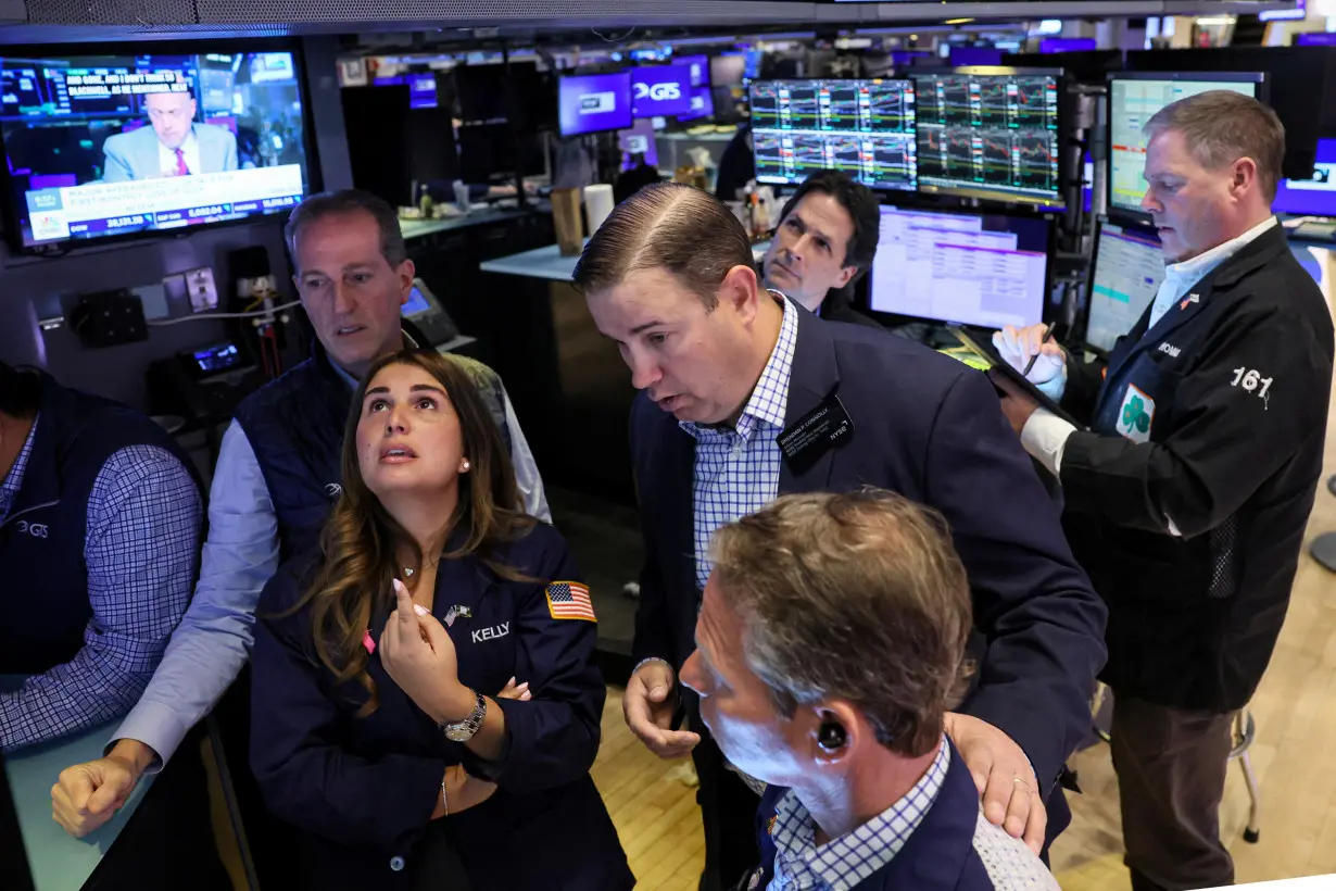 Traders work on the floor of the NYSE in New York