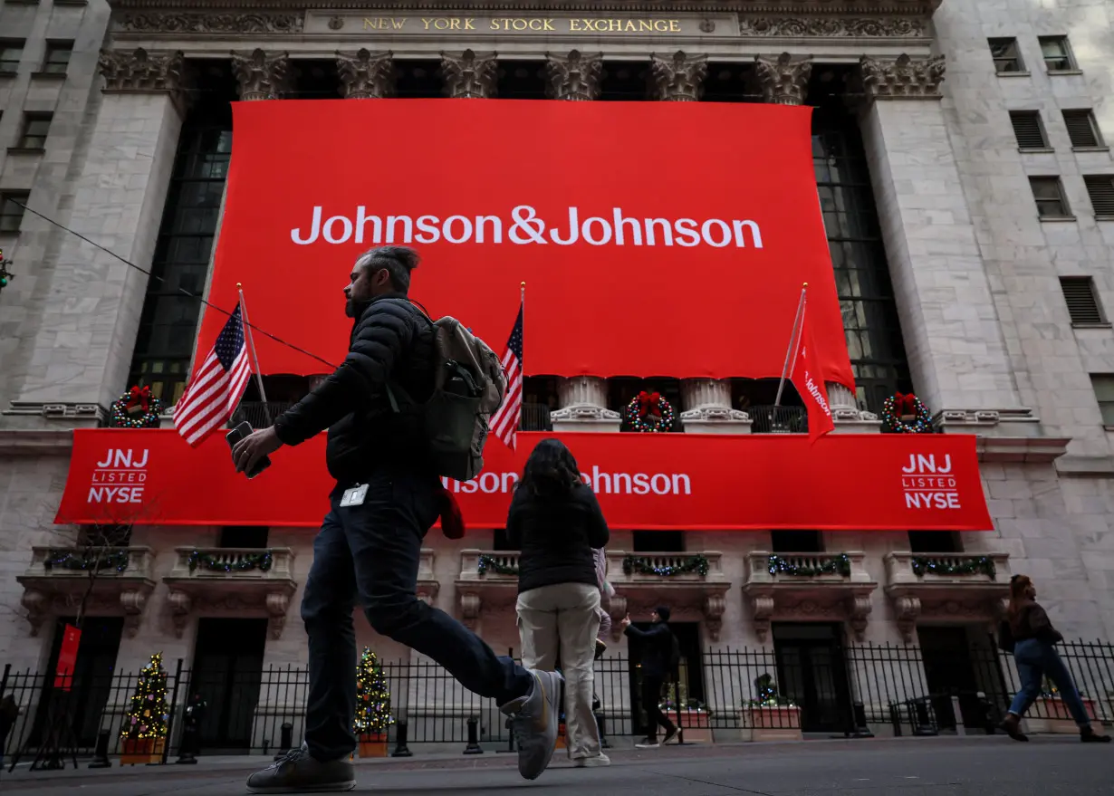FILE PHOTO: A Johnson & Johnson banner is displayed on the front of the NYSE in New York