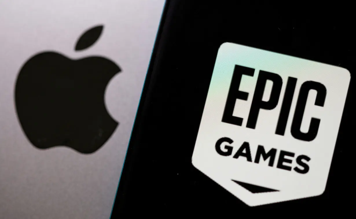 FILE PHOTO: Smartphone with Epic Games logo is seen in front of Apple logo in this illustration taken