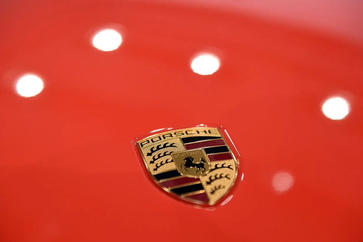 FILE PHOTO: The logo of German carmaker Porsche AG is seen before the company's annual news conference in Stuttgart