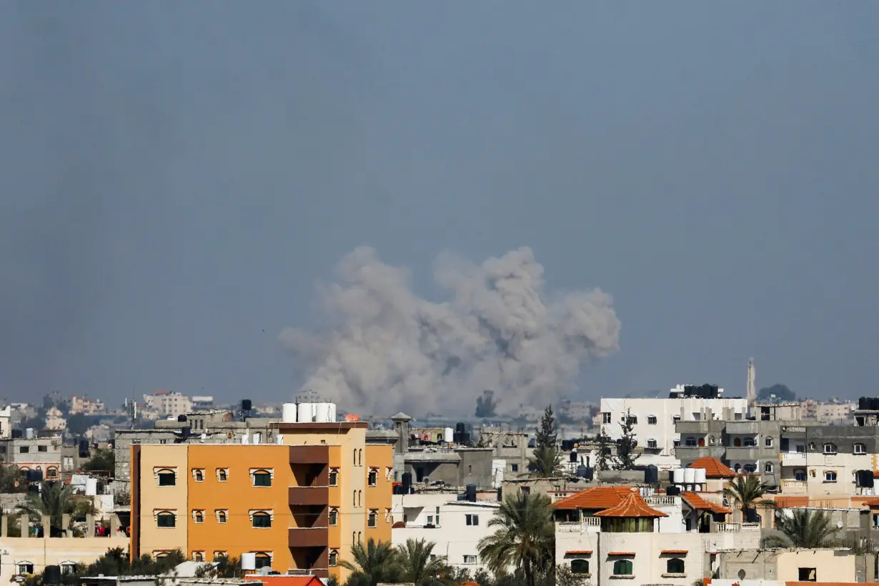 Smoke rises following Israeli strikes, amid the ongoing conflict between Israel and the Palestinian Islamist group Hamas, as seen from Rafah