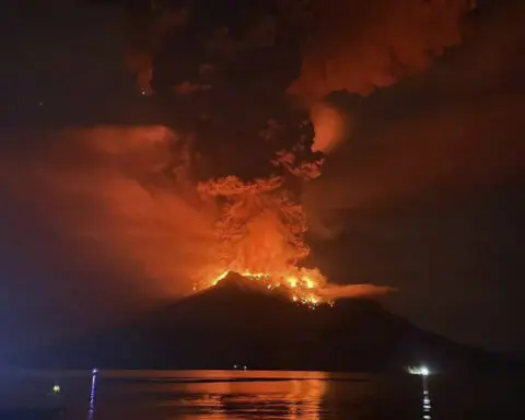 Tsunami alert after a volcano in Indonesia has several big eruptions and thousands are told to leave