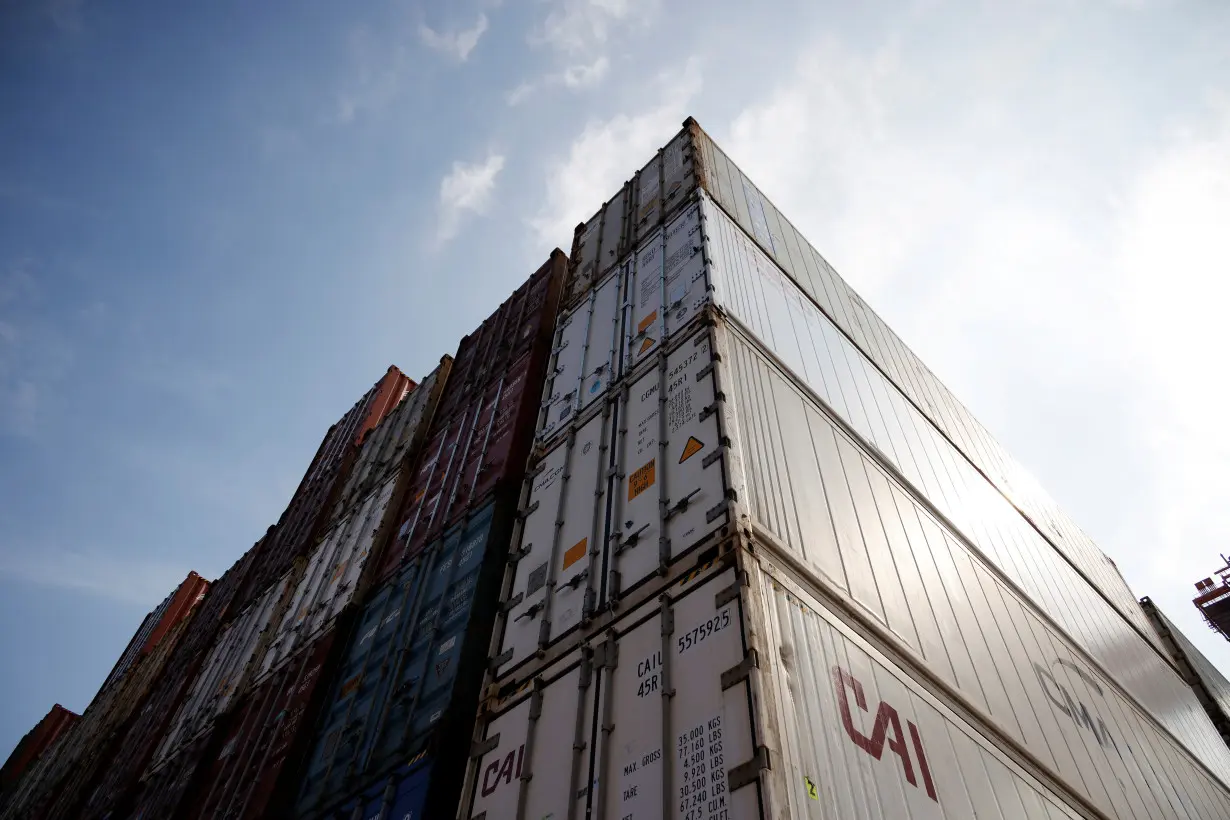 Shipping containers are stacked at Pusan Newport Terminal in Busan