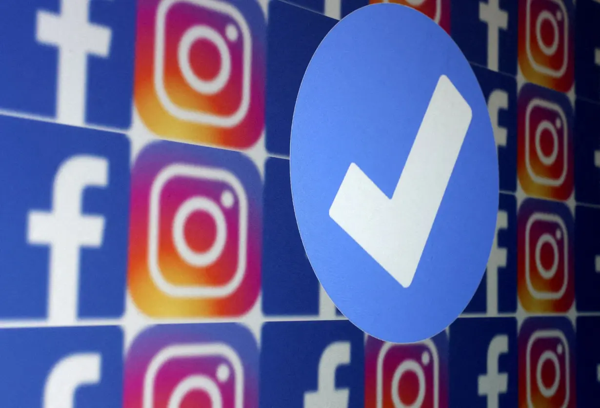 FILE PHOTO: Illustration shows blue verification badge, Facebook and Instagram logos