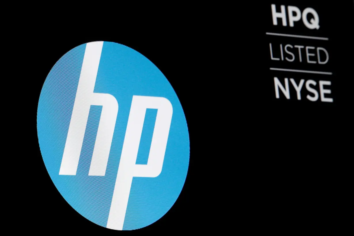 The logo for The Hewlett-Packard Company is displayed on a screen on the floor of the NYSE in New York