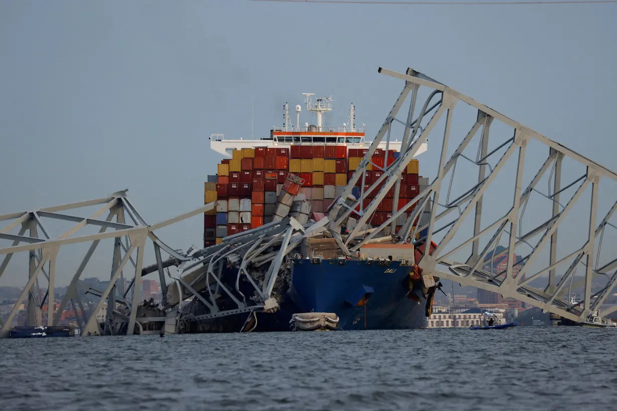 Emergency personnel work at the scene of the Francis Scott Key Bridge collapse in Baltimore