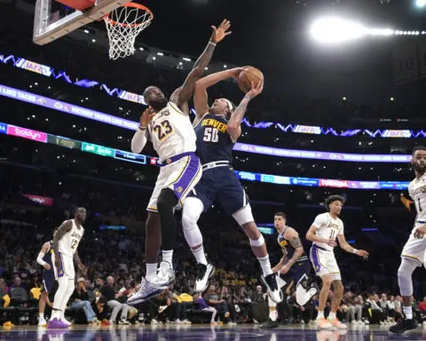 LeBron scores 30, and the Lakers avoid 1st-round elimination with a 119-108 win over champion Denver