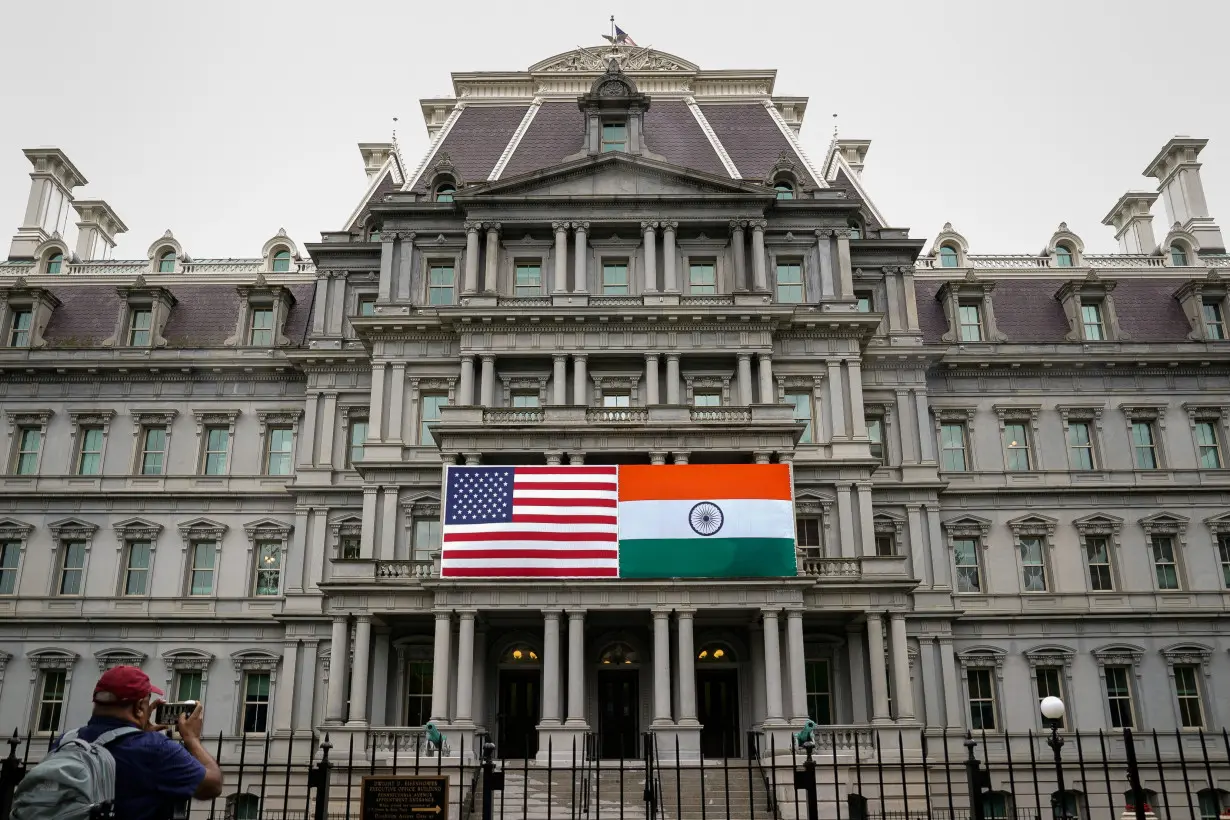 The flags of the United States and India on the Eisenhower Executive Office Building at the White House in Washington