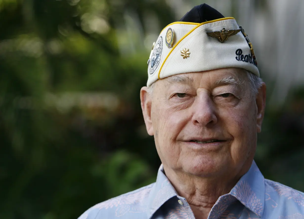 Pearl Harbor survivor Louis Conter poses for the camera at the Hale Koa hotel in Honolulu