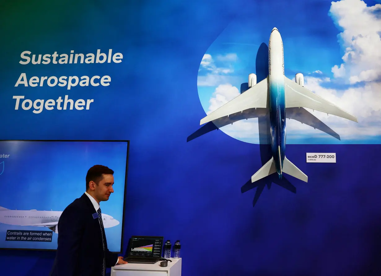 FILE PHOTO: A Boeing ecoDemonstrator 777-200 model plane is pictured at their sustainable aerospace booth area at the Singapore Airshow