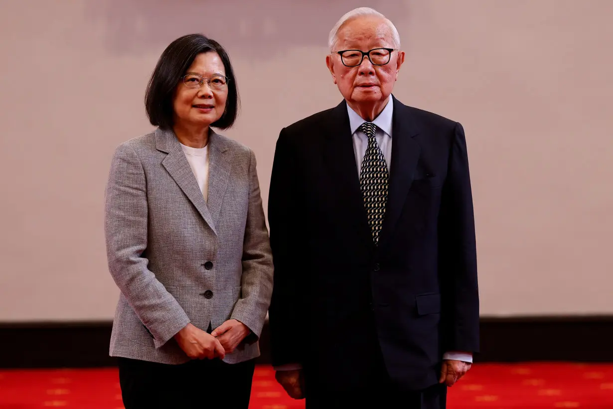 Taiwan's President Tsai Ing-wen poses for a photo with Taiwan's APEC representative and TSMC founder Morris Chang at a press conference in Taipei,