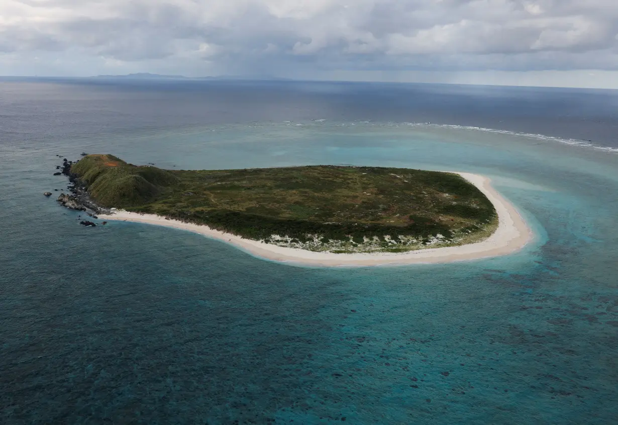 Japanese Ground Self-Defense Force's Amphibious Rapid Deployment Brigade soldiers take part in a military drill at Irisuna island