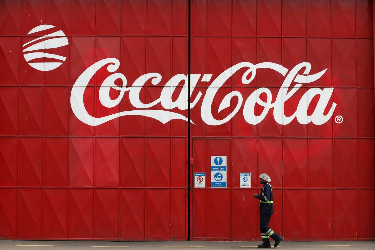 FILE PHOTO: A man walks in the Coca Cola factory in Nairobi