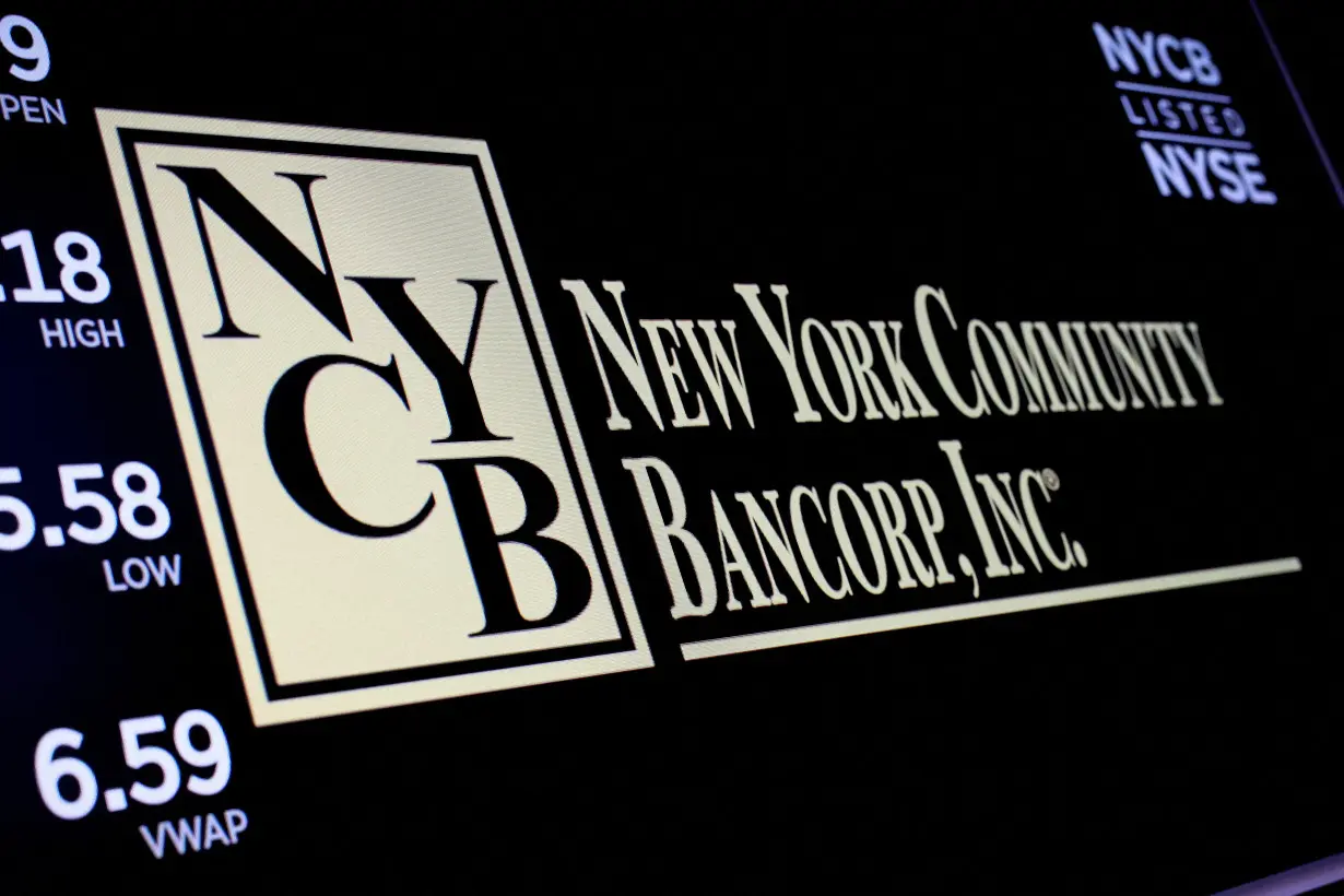 FILE PHOTO: A screen displays the trading information for New York Community Bancorp on the the NYSE in New York