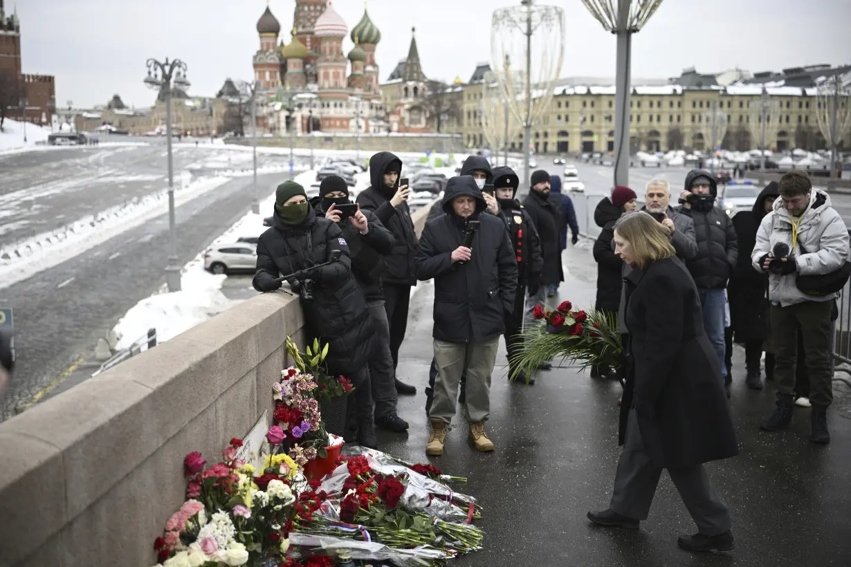 A Russian court sentences the co-chair of a Nobel-winning rights group to 30 months in prison