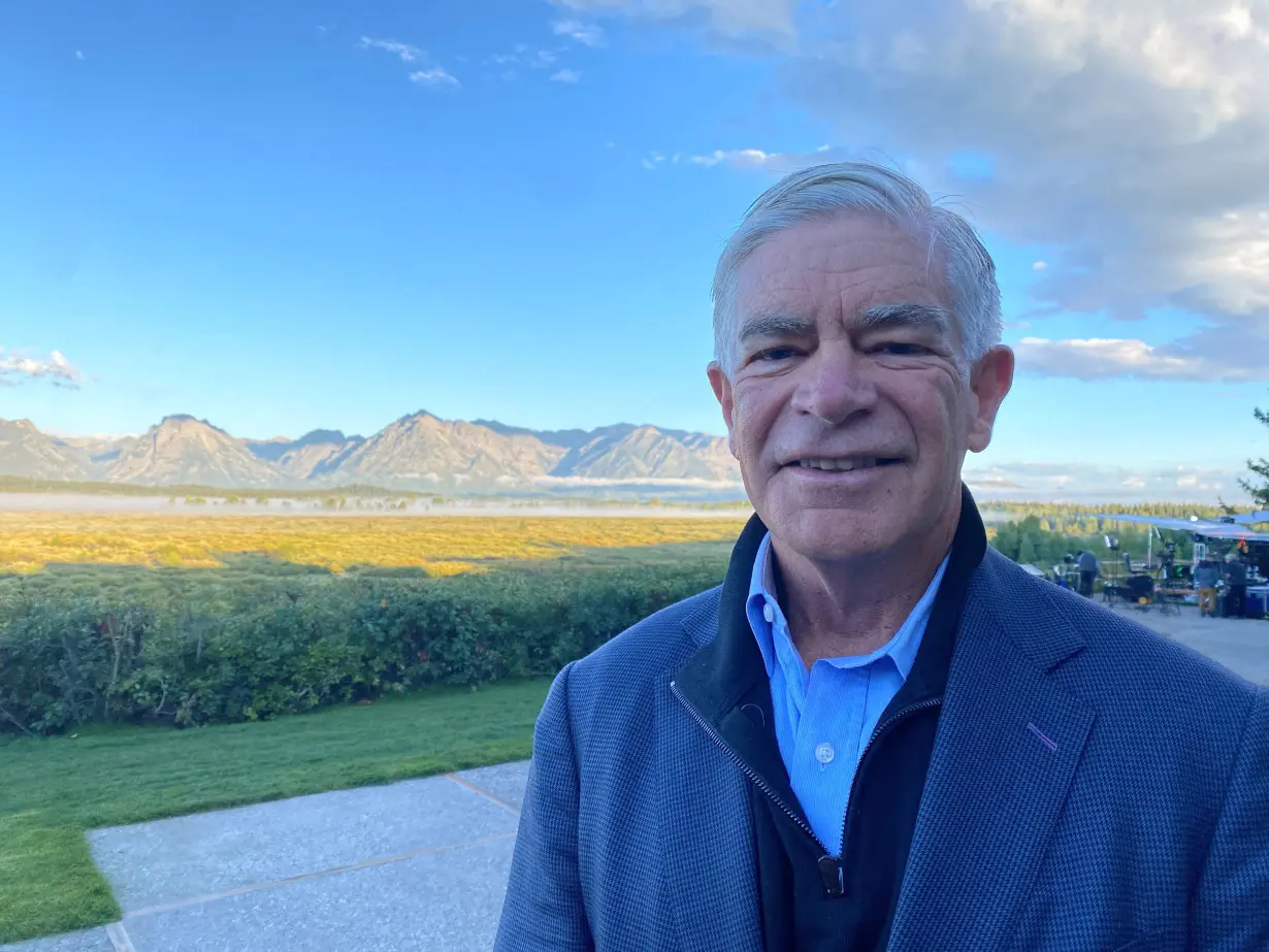 FILE PHOTO: Philadelphia Federal Reserve President Patrick Harker stands behind the Jackson Lake Lodge in Jackson Hole, Wyoming