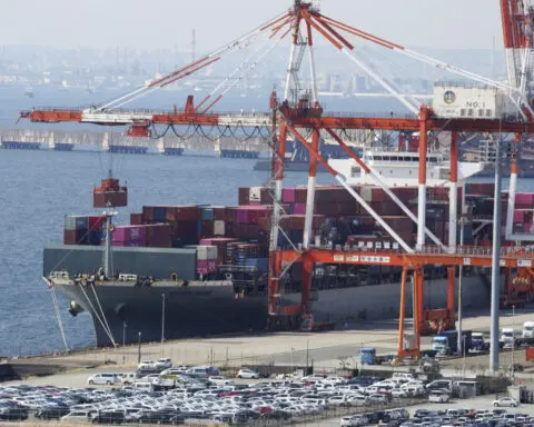 Japan records a trade deficit for the third straight fiscal year despite recovering exports