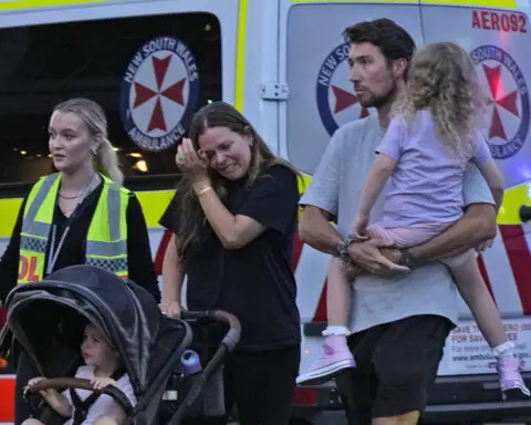 Officer, bystanders hailed for confronting and stopping a man who killed 6 at a Sydney shopping mall