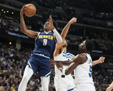 Jokic scores 41 points and leads Nuggets past Timberwolves 116-107 to take lead in West