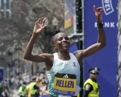 Military marchers set out from Hopkinton to start the 128th Boston Marathon