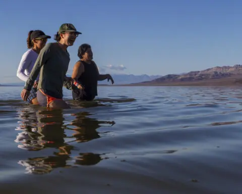 Kayakers paddle in Death Valley after rains replenish lake in one of Earth's driest spots