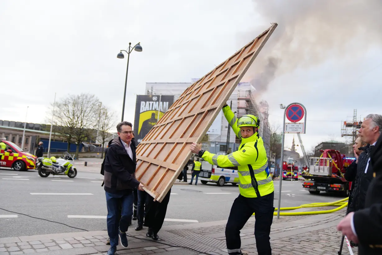 Copenhagen fights the last pockets of a fire that destroyed a 400-year-old landmark