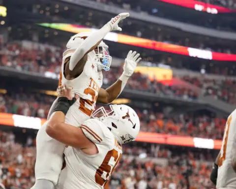 Ewers throws 4 TDs as No. 7 Texas bids farewell to Big 12 with 49-21 title win over Oklahoma State