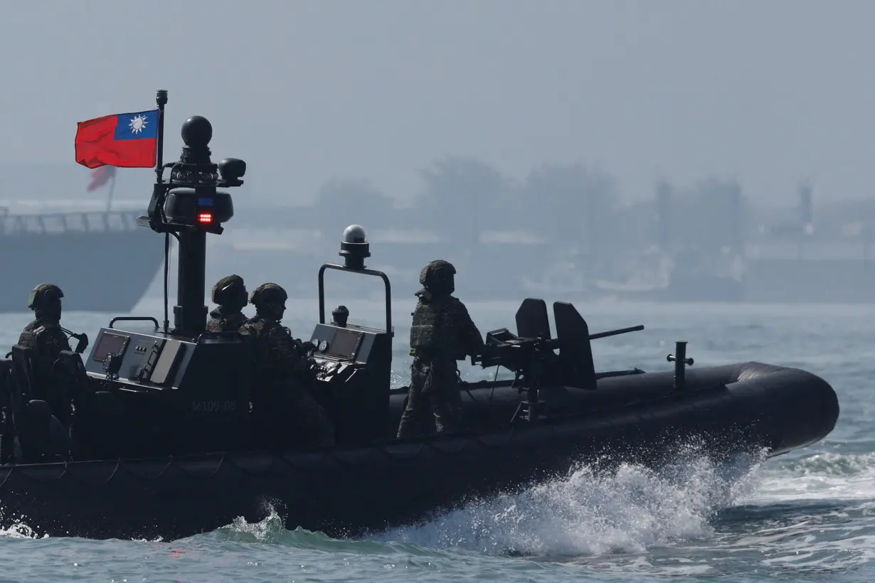 Members of Taiwan's Navy in a drill part of a demonstration for the media at a navy base in Kaohsiung