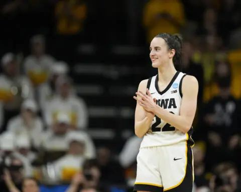 Clark scores 32 as top seed Iowa survives to top West Virginia, 64-54