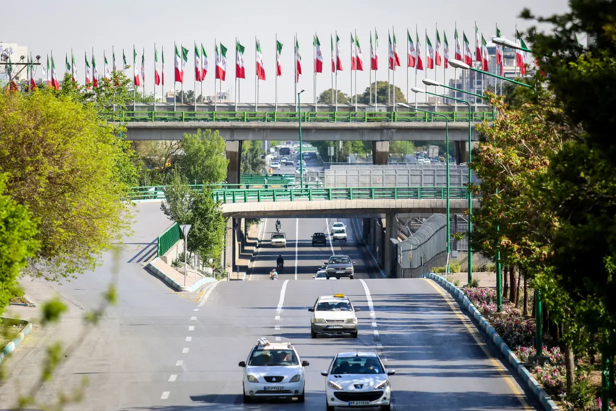 Cars drive on a street, after a reported Israeli attack on Iran, in Isfahan Province