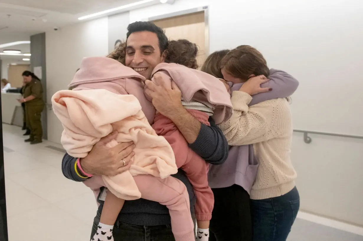 The moments following the arrival of released Israeli hostages in Israel, after they were held by Palestinian militant group Hamas in the Gaza Strip